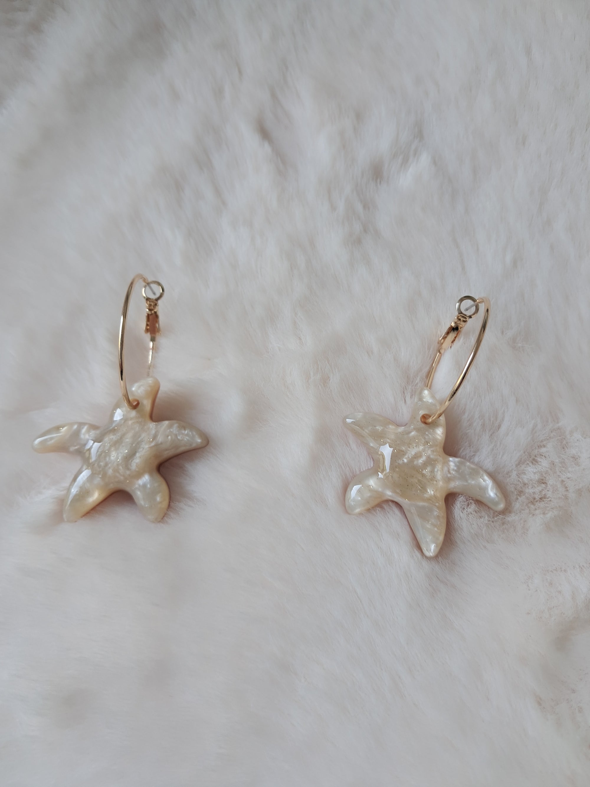 Pendientes aro dorado con estrella de mar